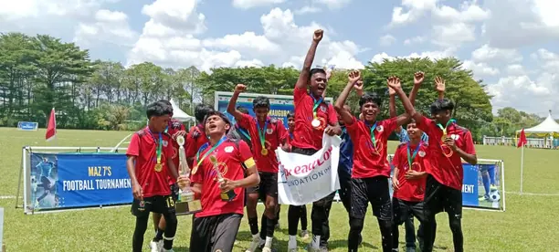 Team celebrating at a football tournament